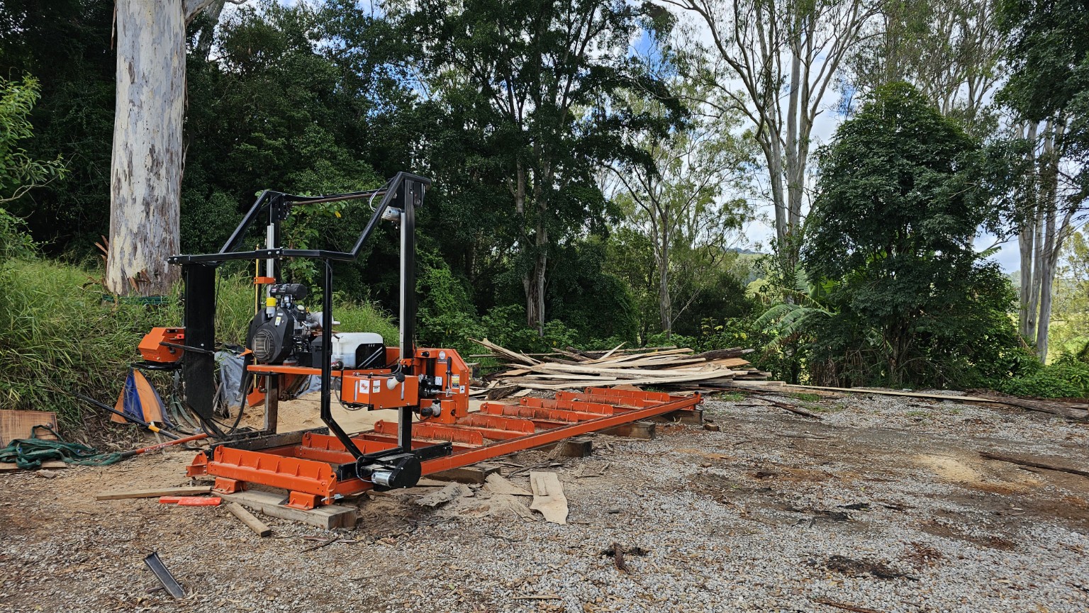 Wide view of a portable sawmill and timber yard